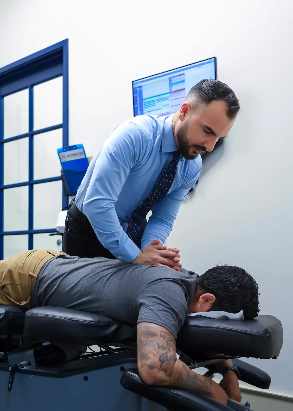 Chiropractor performing a drop table adjustment