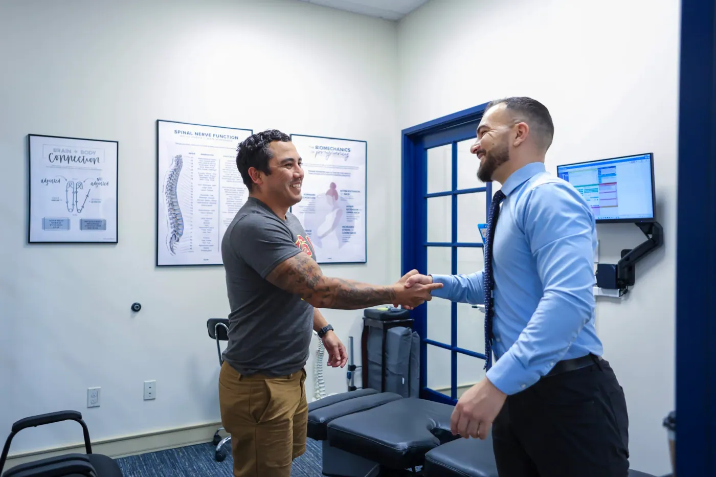 Dr. David Sedghi giving handshake to male patient
