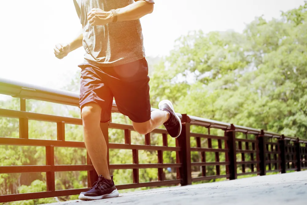 man jogging around the bridge