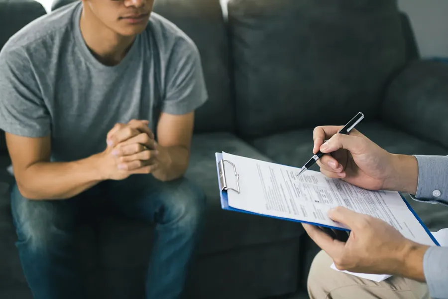 Patient filling out new patient forms