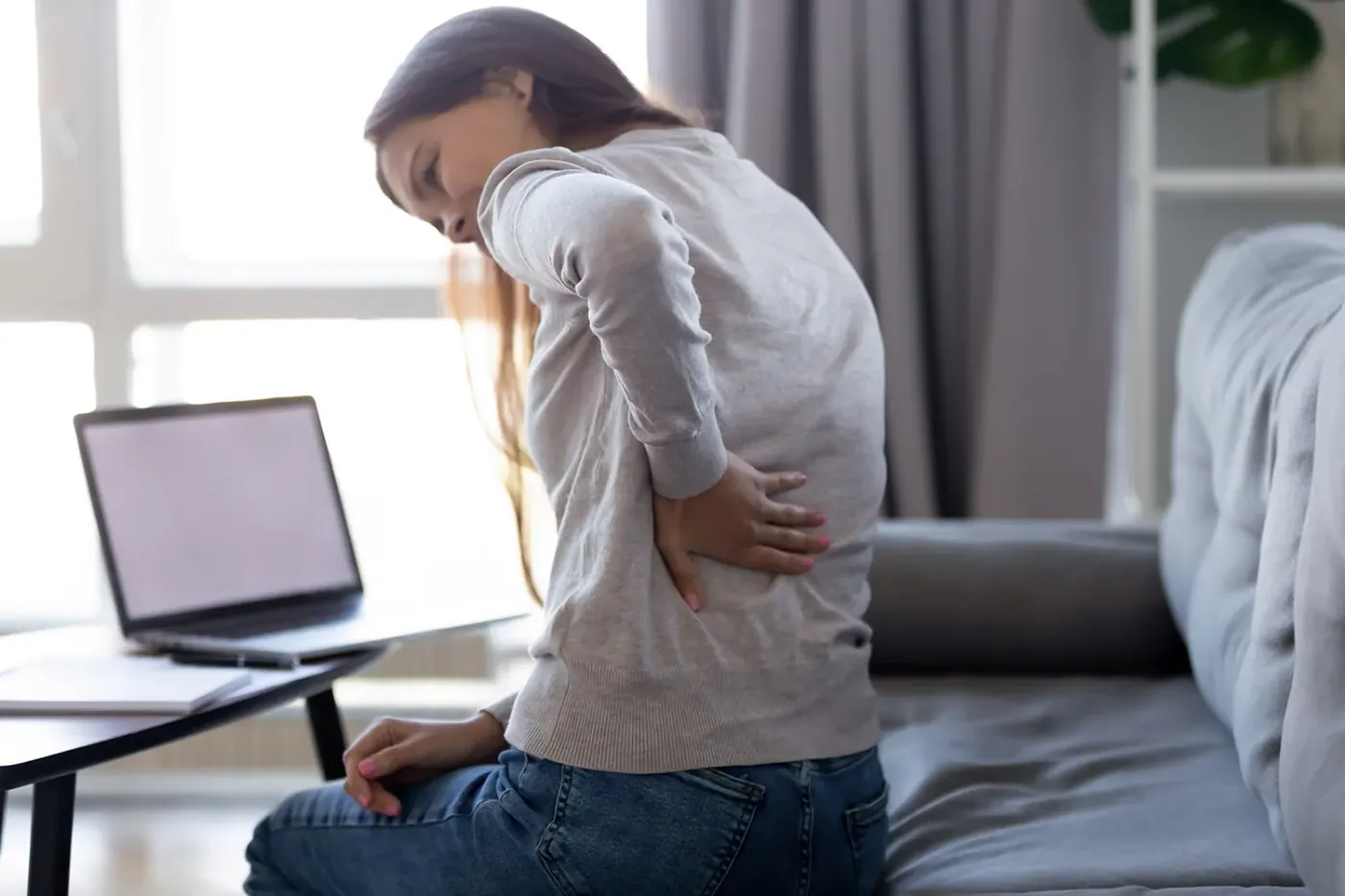 Woman suffering from back pain