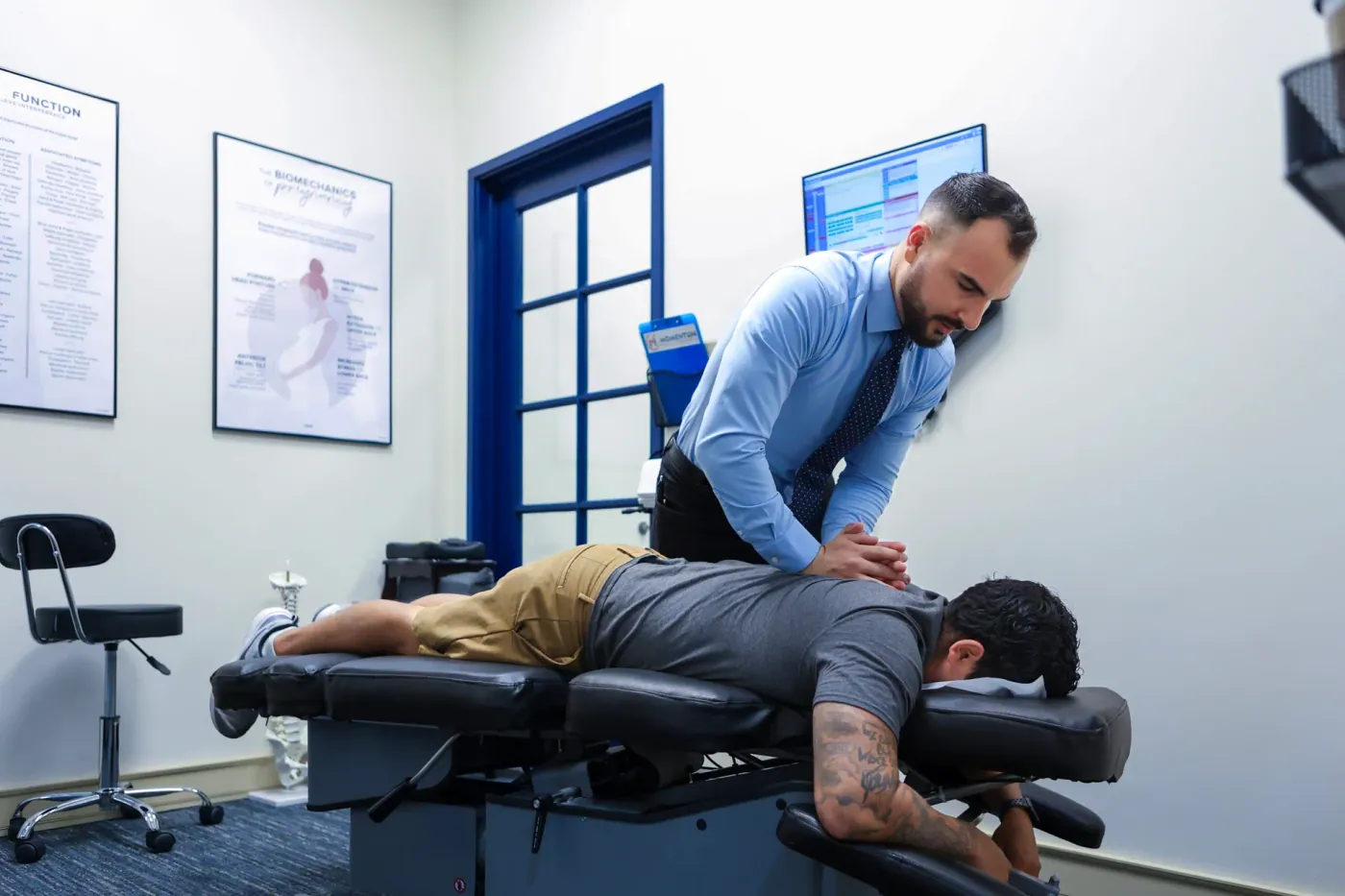 Dr. David Sedghi giving back pain treatment