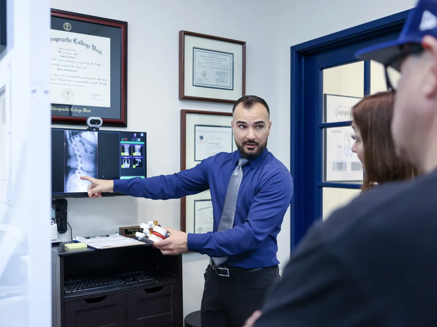 Dr. David Sedghi showing couple patient xray result