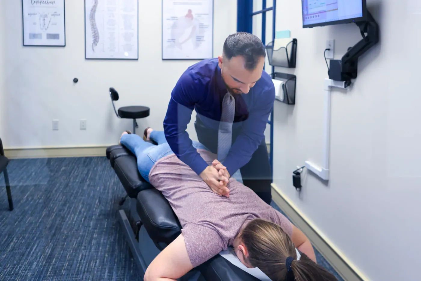 Dr. David Sedghi giving patient back pain treatment